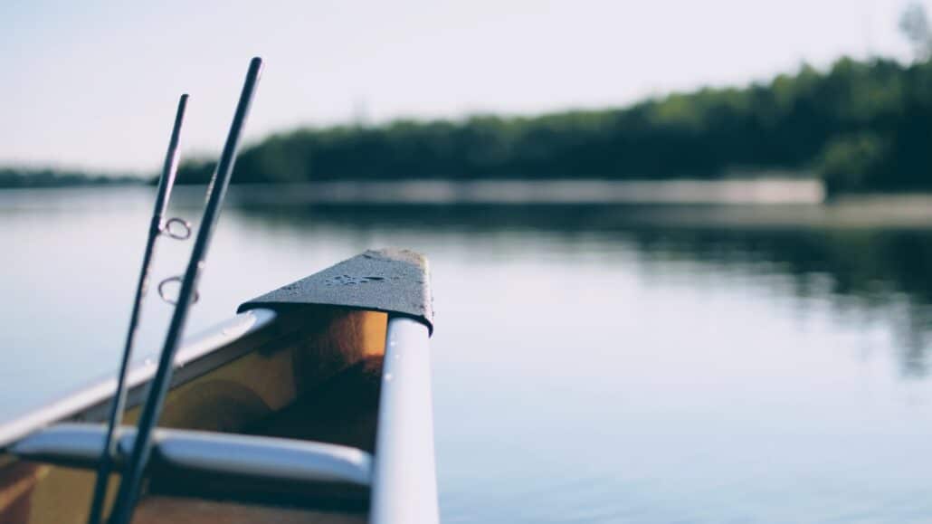 canoe on a lake | Photo by John Sekutowski on Unsplash
