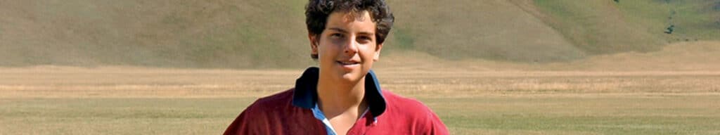 St. Carlo Acutis with the Umbrian Valley behind him.