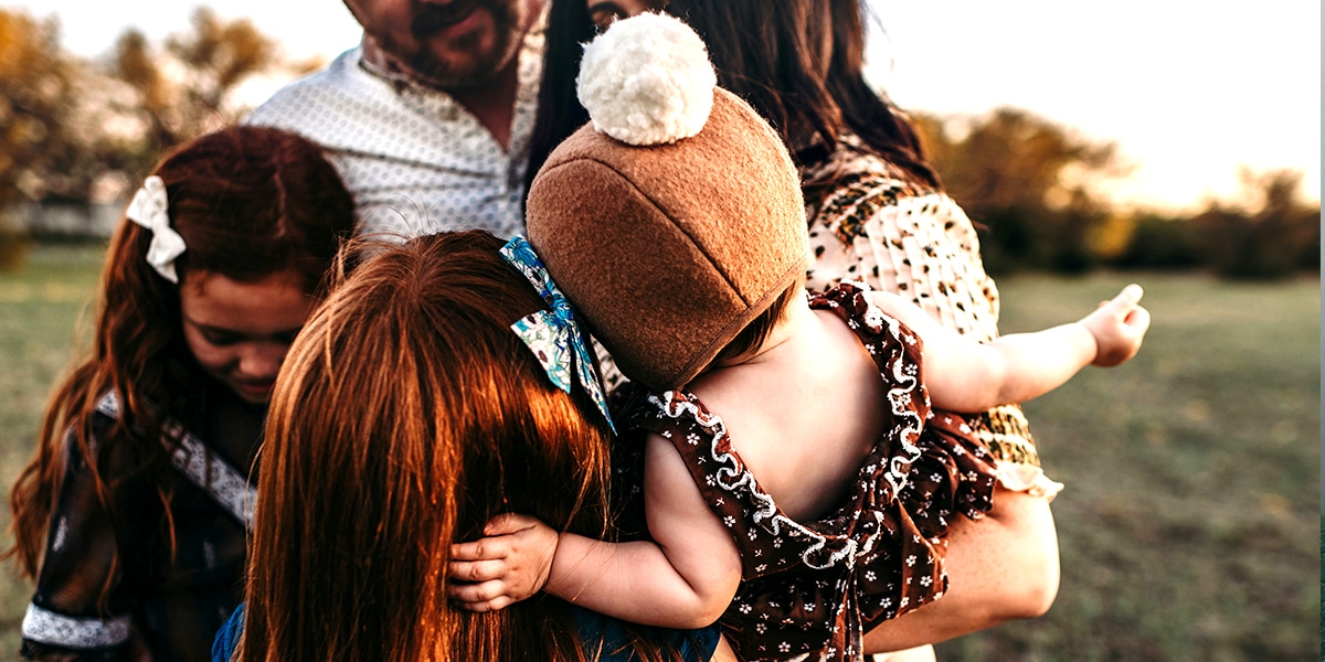 Family, parents and children, hugging
