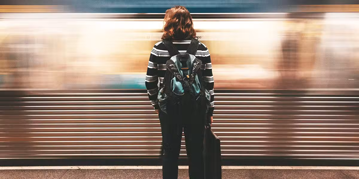 A woman waiting for a train.