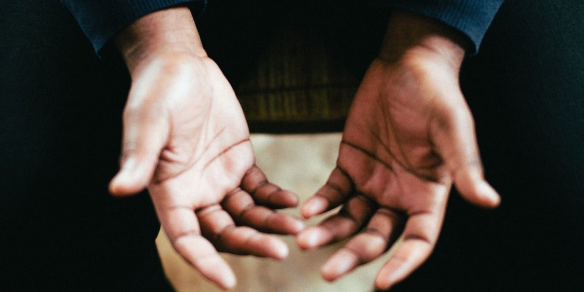 hands open in prayer