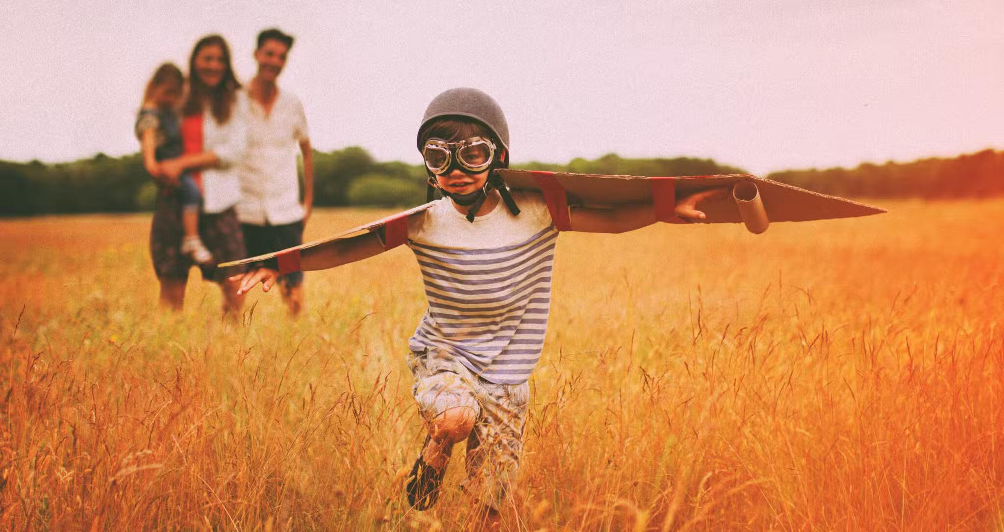 kid with wings pretends to fly