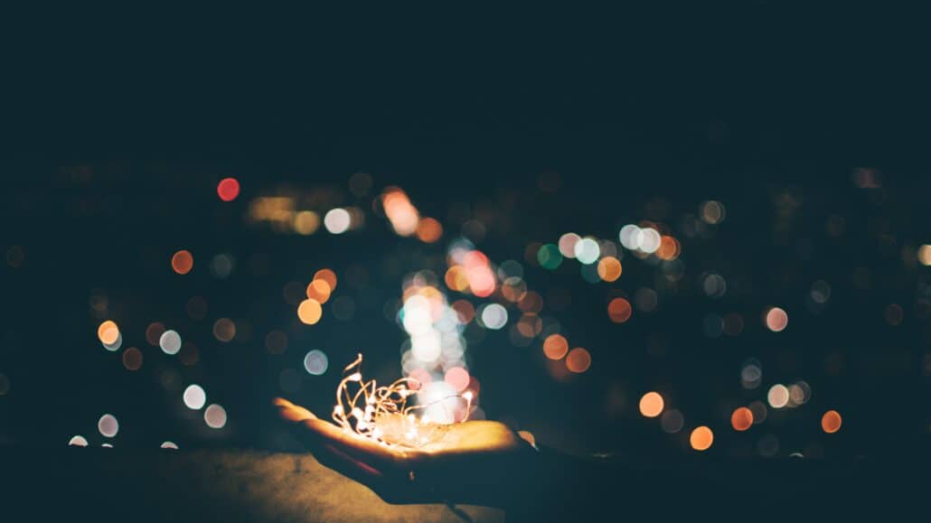 Holding stringed lights | Photo by Yeo Yonghwan on Unsplash