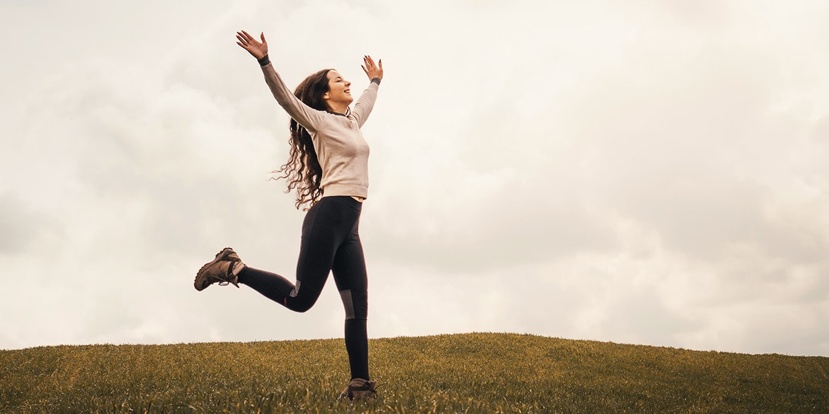 woman dancing because of joy and thankfulness