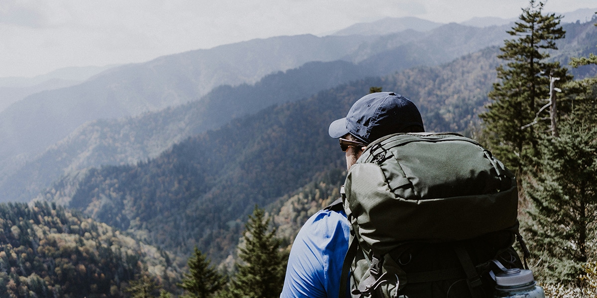 man hiking in mountains