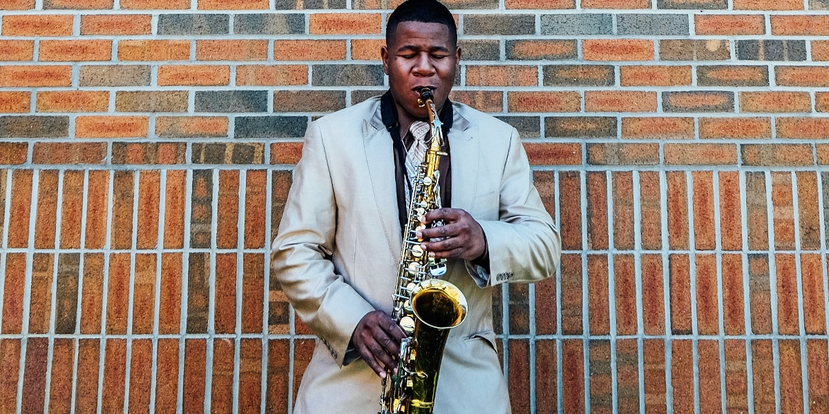 man playing jazz on a saxophone