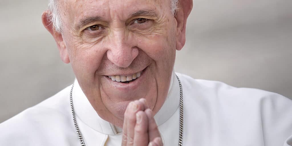 Pope Francis smiling for the camera.