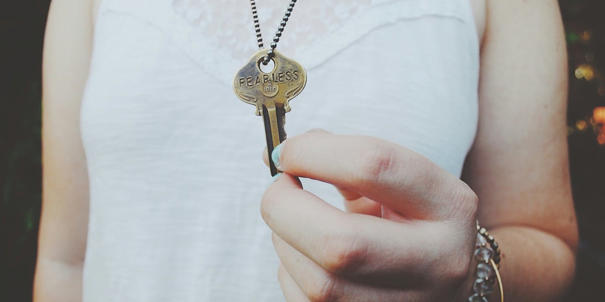 person holding a key in their hand