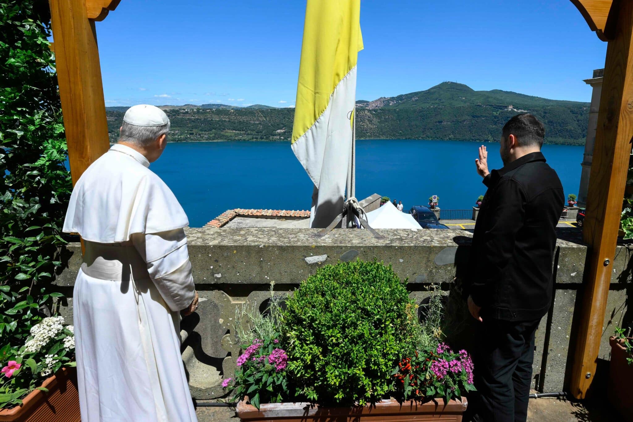 Pope Leo XIV and Ukrainian President Volodymyr Zelenskyy wave from the papal villa in Castel Gandolfo, Italy, during their meeting July 9, 2025. (CNS photo/Vatican Media)