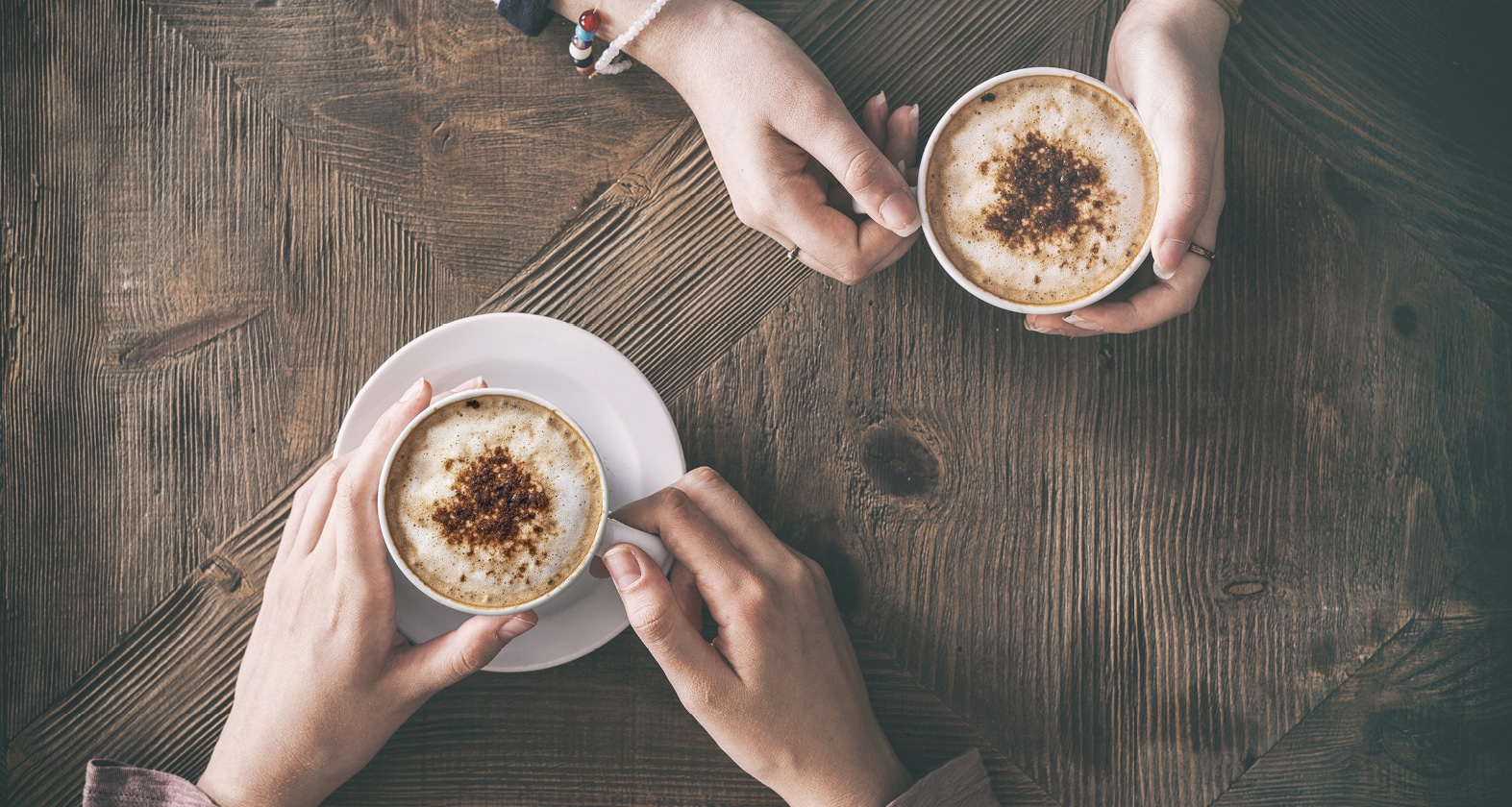 Two people drinking coffee
