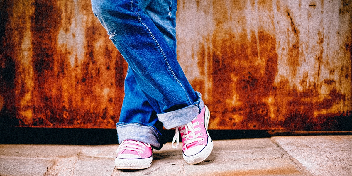 legs of a person in a relaxed pose while waiting