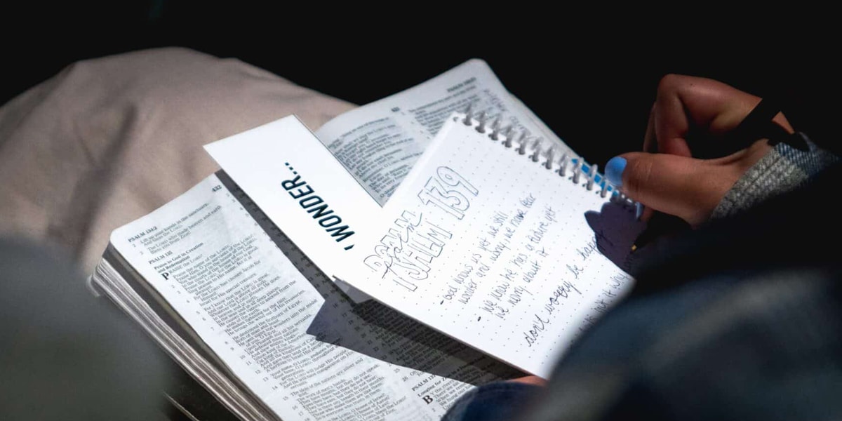 Woman writing in a notebook