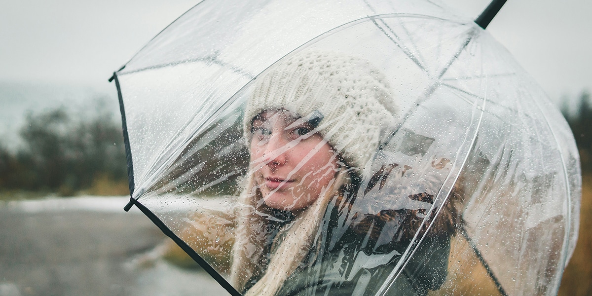 woman holding an umbrella in the rain.