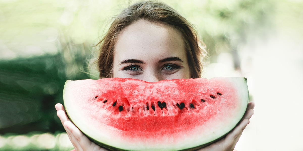 woman eating a watermelon for healthy living