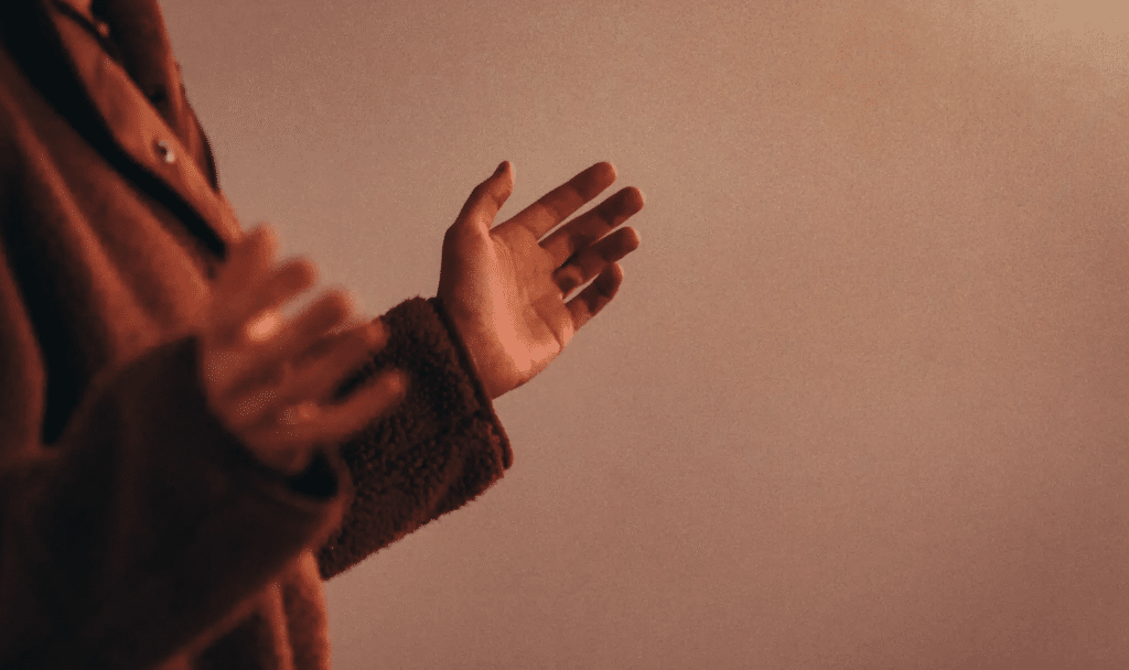 A woman prays prayerfully